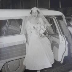 the bride getting out of a wonderful station wagon