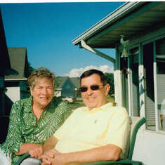 Marie and Phil visiting and on the deck of 130 Lighthouse Way N.