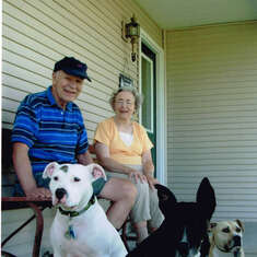 with three granddogs in front of 130