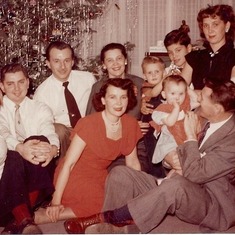 Yule 1952 ~ Top: Mom's sis Alyce &  hubby Dan Alexa, Dan Marusevich & Mom's sis Helene, cousins Robert & Terry, his Mom Marie (Marissa) Bottom: Ted Krupnik, Mom Lorett ~ she loved red! ~ Dad Mel holding me. Off camera my Aunt Del is probably next to Ted.