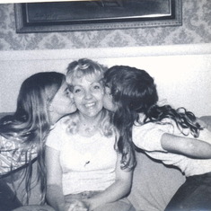 Me and Miquette kissing Mom