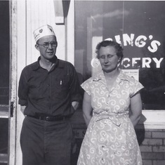 Grandpa and Grandma Ring in front of their store.