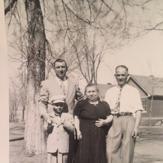 Dad/Lou as a little boy with his Father, Louie, his Grandmother (Nettie's Mother) and his Uncle Raleigh (Nettie's brother-in-law) outside their Denver Home off of 44th and Wyandot.