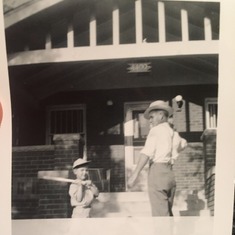 Dad/Lou as a little boy coming back from playing baseball with his Father, Louie Sr. Mortellaro
