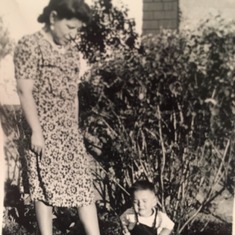 Dad/Lou as a toddler with his Aunt Jenny (Dad/Lou's Father's older sister), in their backyard.