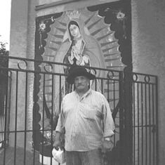 Dad standing in front of mural of Our Lady of Guadalupe on the westside of Kansas City, MO -- his old neighborhood.