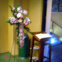 Flower Cross in memory of Louis Vela and Guest Book.