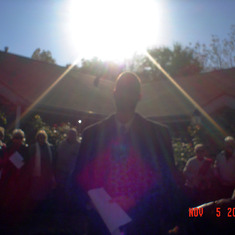 Pastor Chris Morris and God shining down on the blessing of the memorial bricks.