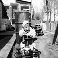 JR (Louis Vela Jr.) He loved his little bike as shown by his happy face.