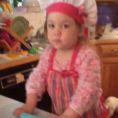 Bella she loved to help mommy Nikky cook.