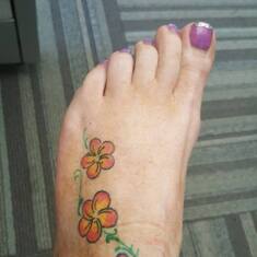 My Plumeria flowers that he tattooed on me freehand!