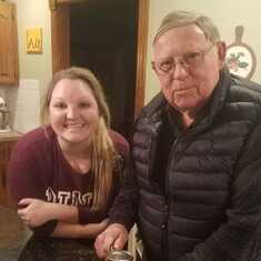 Grandpa showing granddaughter Megan his can opener from the Korean War