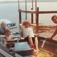 Lucille on a boat in North Carolina with her nephew Bozo and great niece and nephew,