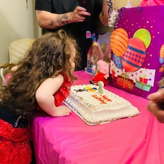 Your granddaughter Melody blowing out her candles 