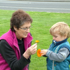 Mum and Jack smelling the flowers together