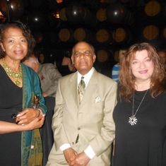 Dr. Mahabir, Evelyn, and Adrienne at a birthday party in 2013