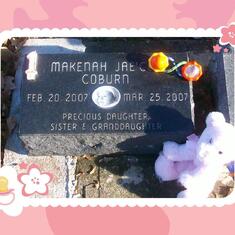 Makenah's headstone and toys