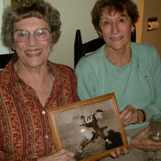 Marcia and her sister Diana, with a photo of their father Walter in his Dartmouth days.
