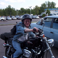 Marcia on her rental motorcycle.  she would buy her husband one similar a Harley Davidson XL1200L in 2006 and they still have it with only 4050 miles