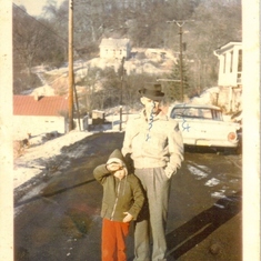 Marcy with Grandfather Bernard "Grump" Nease on Oak St., "Monkey" Run, Pomeroy OH. In front of His house, her house on the hill in the background. Grandma Thelma helped raise her, my kids too!!