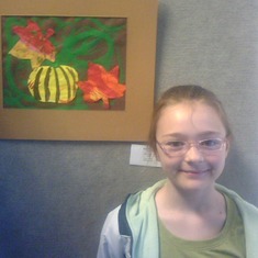 Grand Daughter Aspen with her art on display at a local bank.
