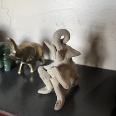 Marga's Clay Elephant. Playing a harp and singing a song. This is a true treasure!