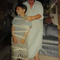 Mum wrapping Philippe in masking tape