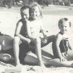 1962 Marg at the beach with Terry, Catherine, and Susan