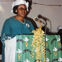 Mrs. Tandap giving a speech at church