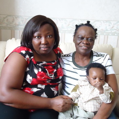 Mum  and her daughter in law  with one of the grandchildren