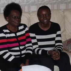 Dr (MRS) OMOTOWA at home in Scotland, with her daughter and a grandchild