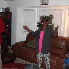 Dr (MRS) OMOTOWA praying with her child and a grandchild