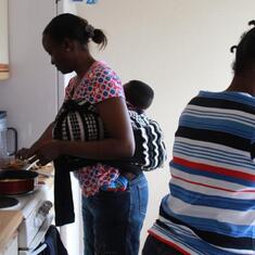 Dr (MRS) OMOTOWA at home in Aberdeen, Scotland, with her daughter and grandchild