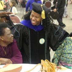 Dr (MRS) OMOTOWA with an in-law at the doctoral degree graduation of her daughters-in-law