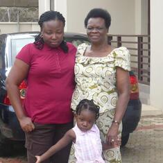 Dr (MRS) OMOTOWA with her daughter-in-law and grandchild