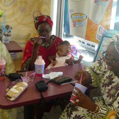 Dr (MRS) OMOTOWA with her daughters-in-law and a grandchild