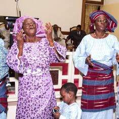 Dr (MRS) OMOTOWA at church with her children, daughter-in-law and grand children