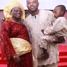 DR (MRS) OMOTOWA with her son-in-law and grandchild