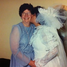 Tia Hilda kissing grandma at her wedding