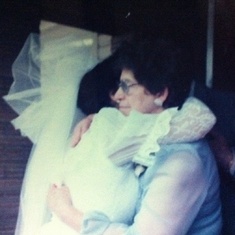 Tia Hilda hugging Grandma at her wedding