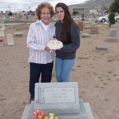 Visiting Grandma's resting place @ Concordia. Aunt Vicha also gave Mika one of her very old Mexican dolls.