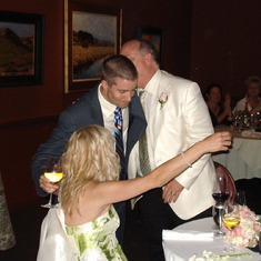 Nick concludes his wedding toast with a hug.