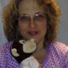 Before Surgery in January. She is with the monkey I bought her from the hospital gift shop. She named it Greta XD She held onto her like it was her job.