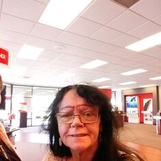 Marie Cavanaugh at Verizon checking out the phones :) haha mom was special