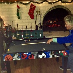 Mom and Sevilla (her only grand-daughter) playing pool.