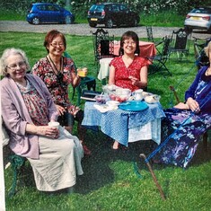 Friends enjoying Mrs Smith's fund raising tea parties outdoors and indoors. Fervent supporter of Stephen's and James life saving work.