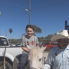 Your grandson is riding a pony. He wish you were there to see him. Miss ya mommy.