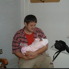 JR holding Cierra when she was new born