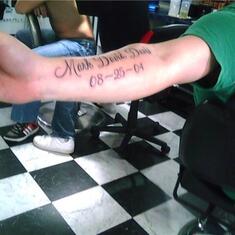 Mark got a tatoo with his son's name and birthday shortly before he died.  His son never got to see it.