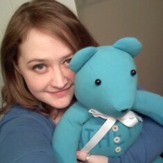 This is Angela with Mr. Bear, a teddy bear made from one of Mark's favorite shirts.